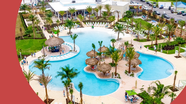 Aerial view of an outdoor resort-style pool at Latitude Margaritaville in Daytona Beach, Florida.