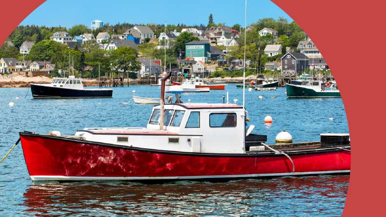 A red lobster boat in the harbor at Stonington, Maine.