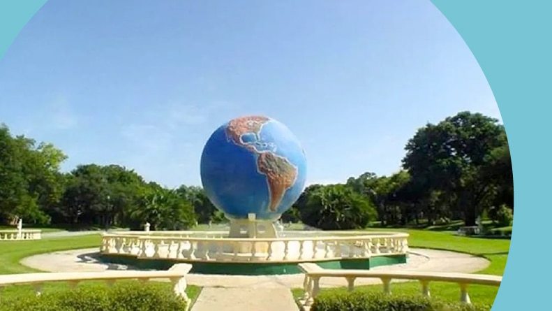 A globe on the grounds of On Top of the World Clearwater.