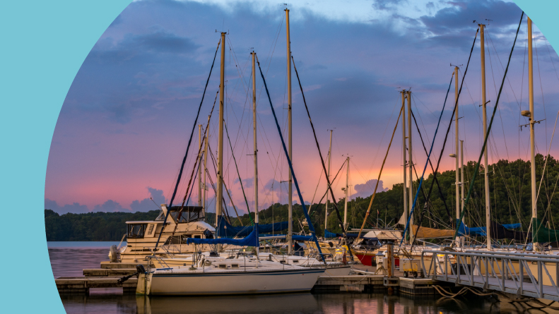 Boats docked on the Tennessee River at sunset.