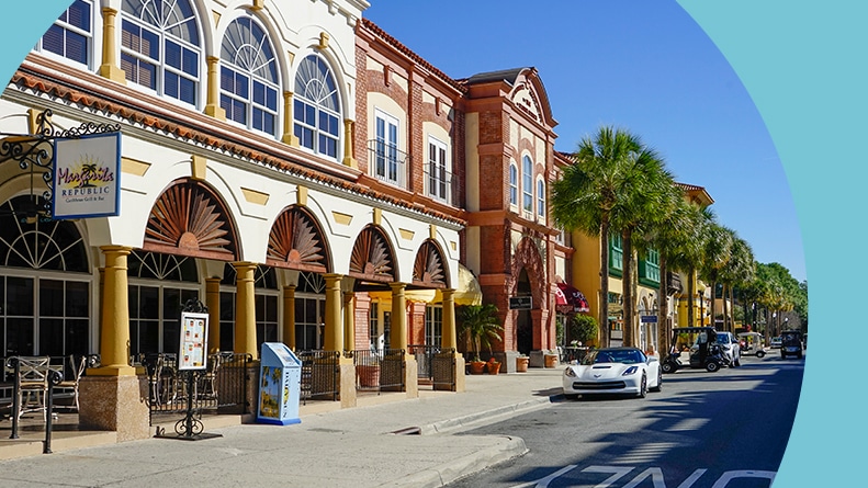 Palm trees and shops lining the street at The Villages in Florida.