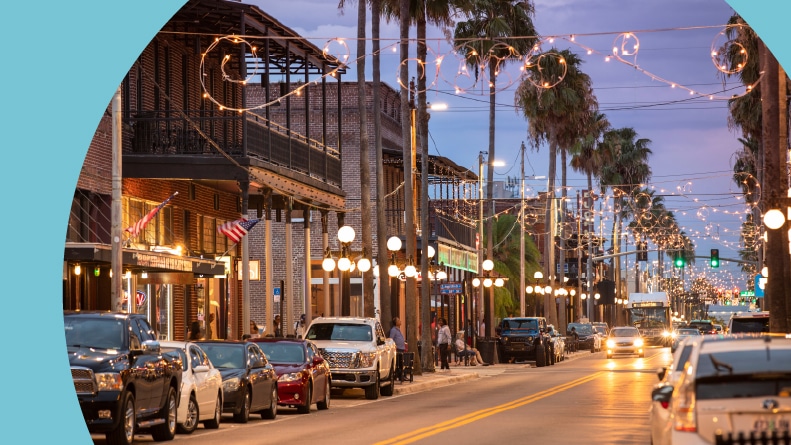 People walking along the downtown bars and restaurants in historic Ybor City in Tampa, Florida.