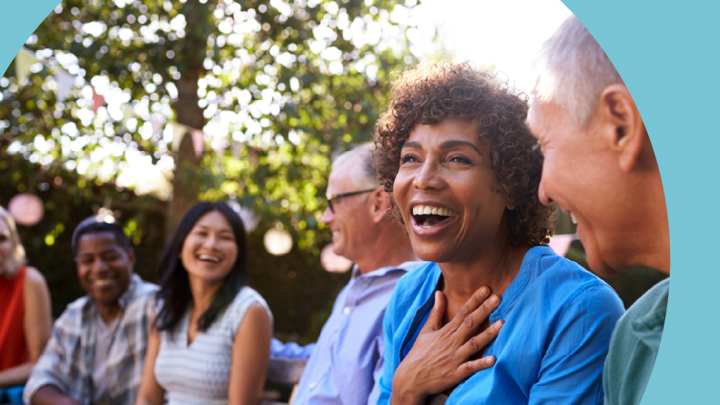 A group of 55+ apartment neighbors socializing outside together.