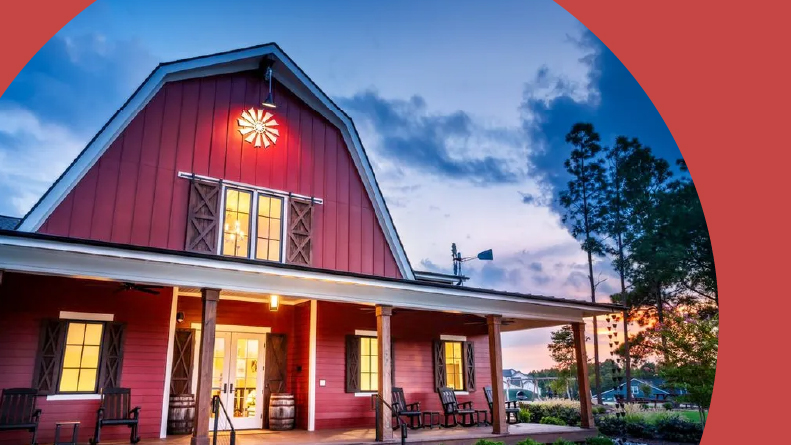 Exterior view of the barn clubhouse at Altis at Serenity in Fuquay-Varina, North Carolina.