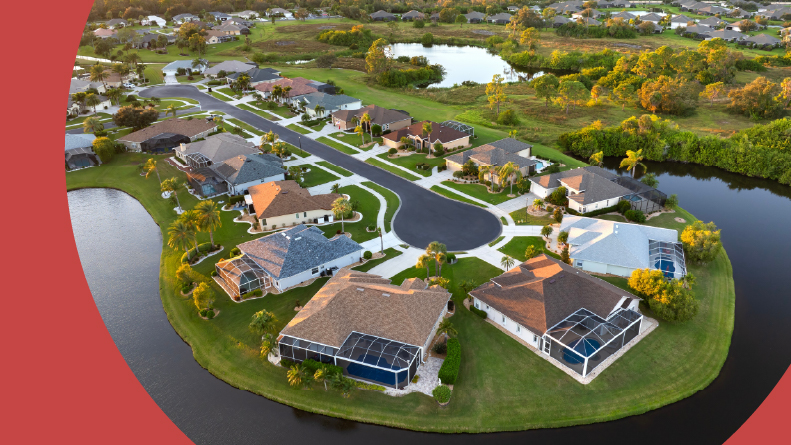Aerial view of waterfront residential houses in North Port, Florida.