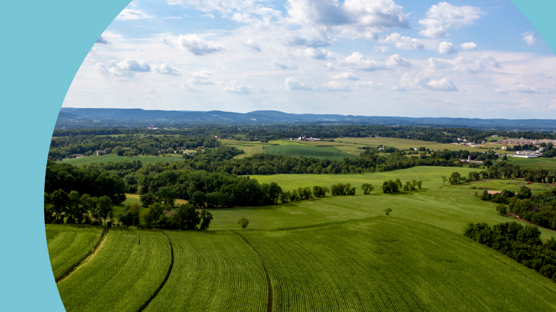 Aerial of Pennsylvania farmland with rows of crops.