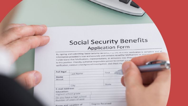 Close-up of a 55+ person filling out a Social Security Benefits form.
