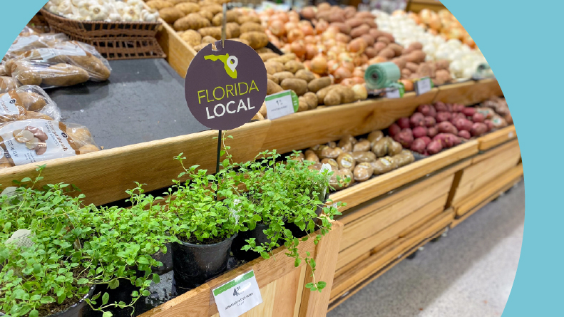 Fresh produce aisle featuring a variety of locally sourced potatoes and herbs at a Florida grocery store.