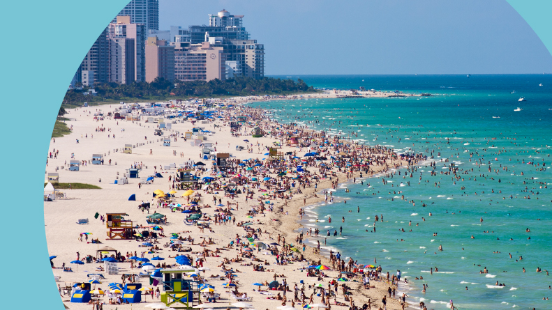 Aerial view of crowds of people on South Beach in Miami , Florida.
