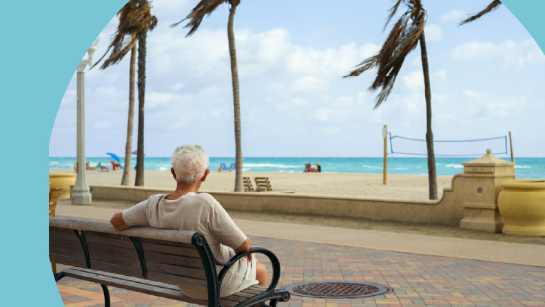 55+ retired man enjoying the sights of the beach.
