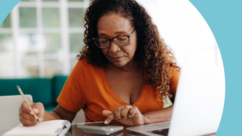 A 55+ woman making calculations on her social security benefits.