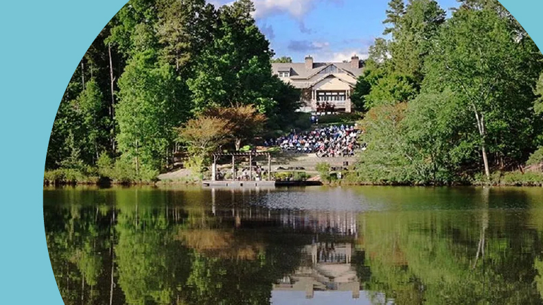 View across the water of the clubhouse at Soleil Laurel Canyon in Canton, Georgia.