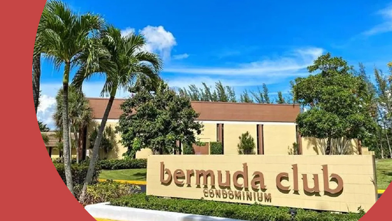 Palm trees beside the community sign for Bermuda Club Condominiums in Tamarac, Florida.