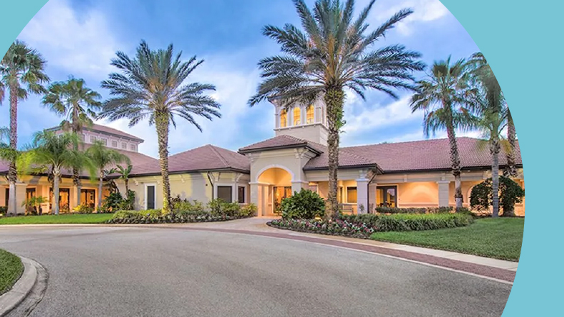 Palm trees beside the clubhouse at Cypress Falls at The Woodlands in North Port, Florida.