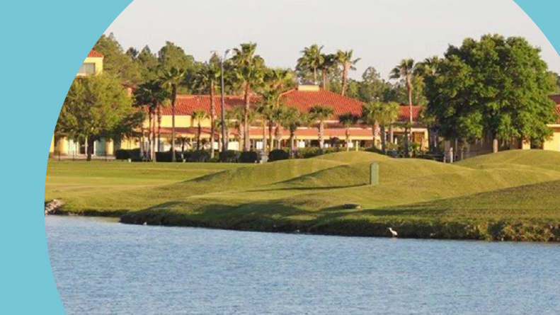 View across the water of the clubhouse at Cypress Lakes.