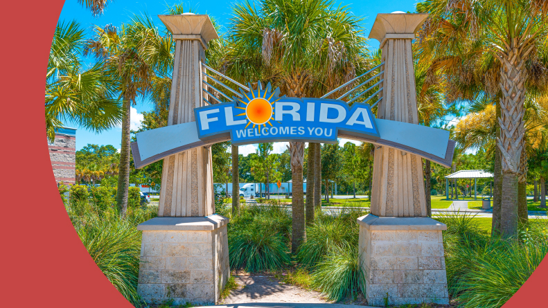 A "Florida Welcomes You" sign at a rest stop in Florida.