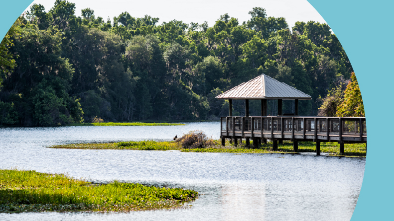 A wooden boardwalk and gazebo in a marsh in Paynes Prairie Preserve State Park in Gainesville, Florida.