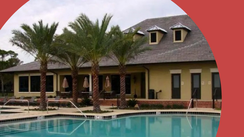 Palm trees beside the outdoor pool at Plantation Bay Golf & Country Club in Ormond Beach, Florida.