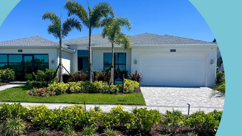 Palm trees beside a model home at Regency at Waterset, one of many stay and play retirement communities in Florida.