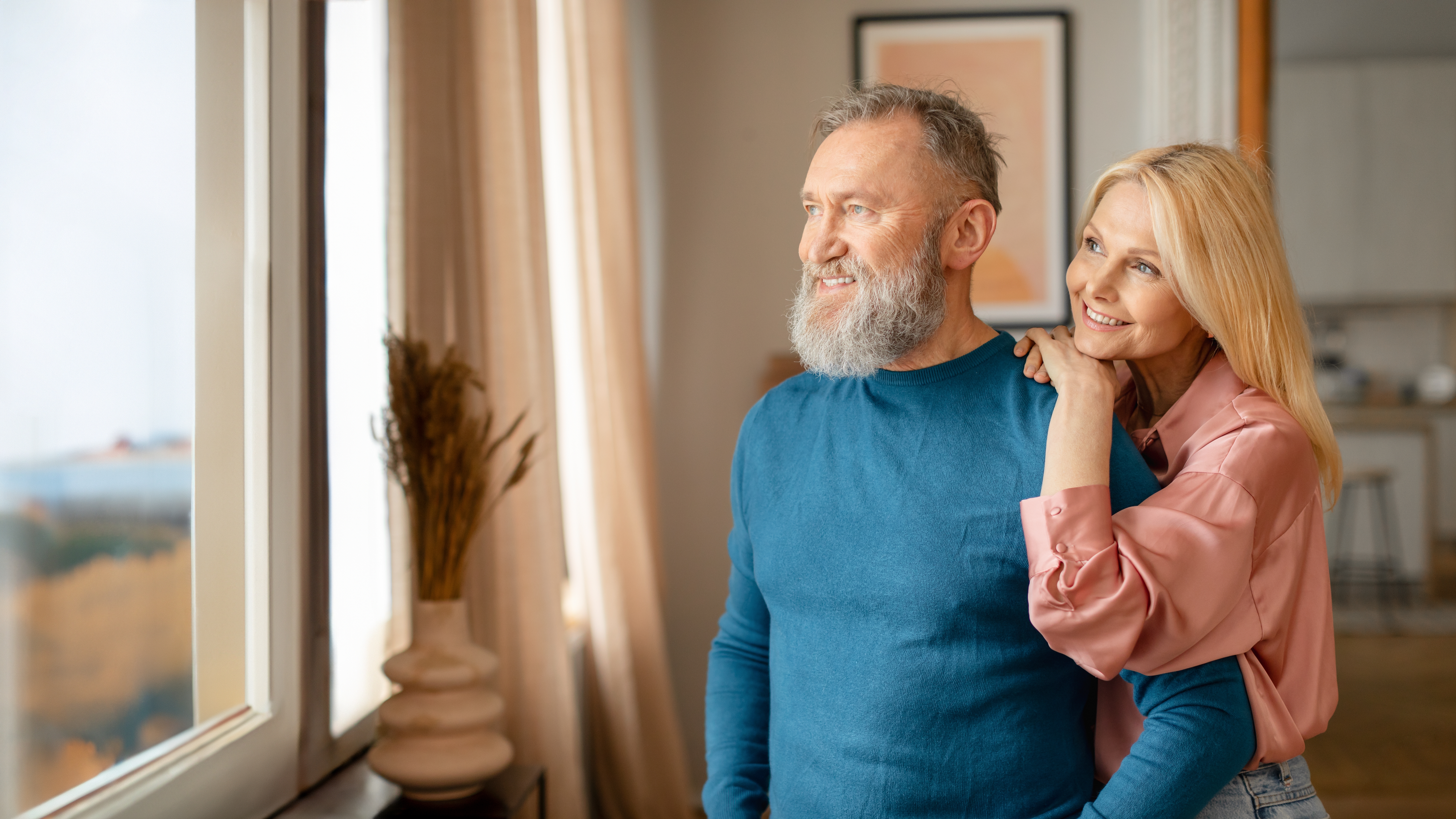 An active adult couple in their new 55+ apartment.