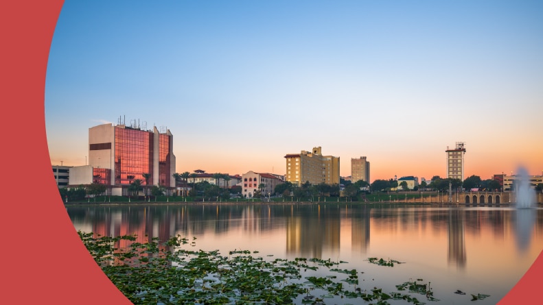 The downtown cityscape on the lake at dawn in Lakeland, Florida.