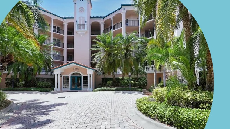 Palm trees surrounding a residential building at The Landings in Sarasota, Florida.