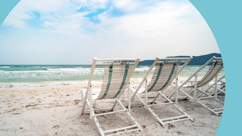 Summer white beach chair with a blue sky background and clouds.