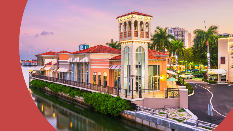 The downtown cityscape on the canals at dusk in Naples, Florida.