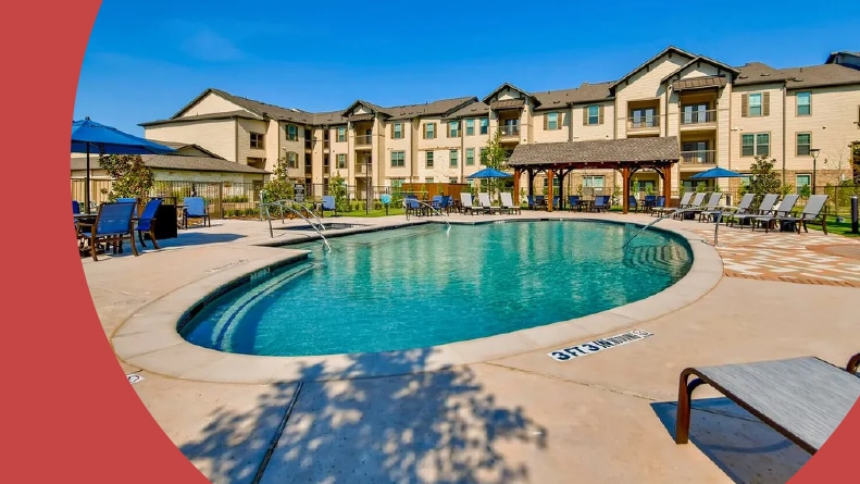 Lounge chairs beside the outdoor pool in Alders Rockwall in Rockwall, Texas.