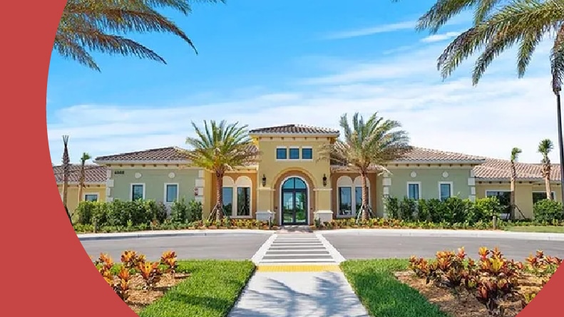 Palm trees beside the entrance to Del Webb Naples in Ave Maria, Florida.