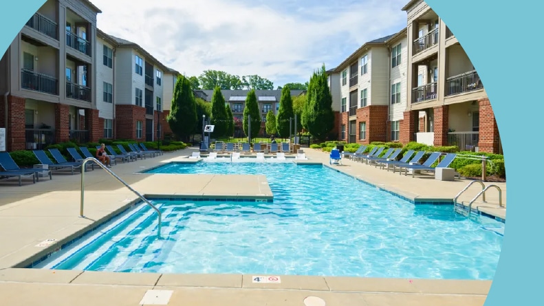 Lounge chairs beside the outdoor pool at Fountains Matthews in Matthews, North Carolina.