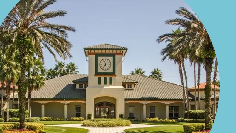 Palm trees surrounding the clubhouse at Legacy of Leesburg in Leesburg, Florida.