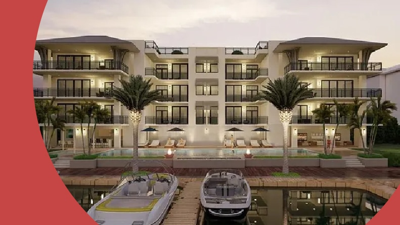 Boats docked beside a residential building in Moorings in Naples, Florida.