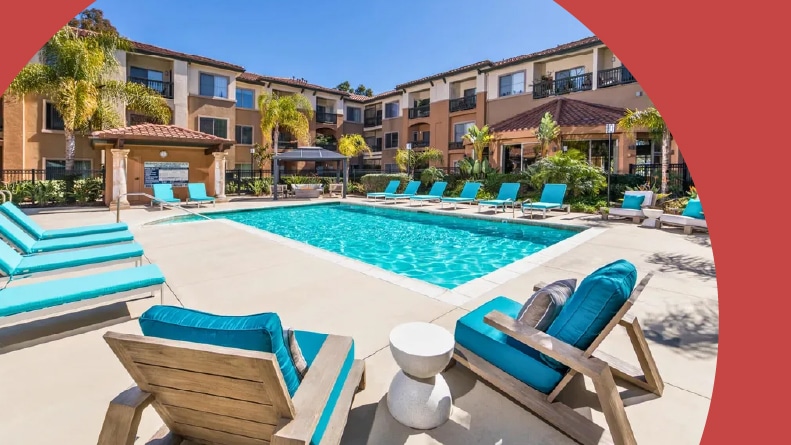 Lounge chairs beside an outdoor pool at Overture Rancho Santa Margarita in Rancho Santa Margarita, California.