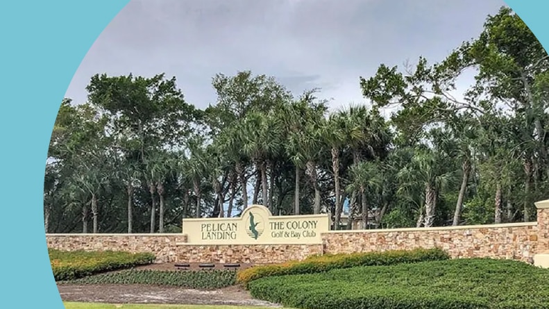 The community sign for Pelican Landing in Bonita Springs, Florida.