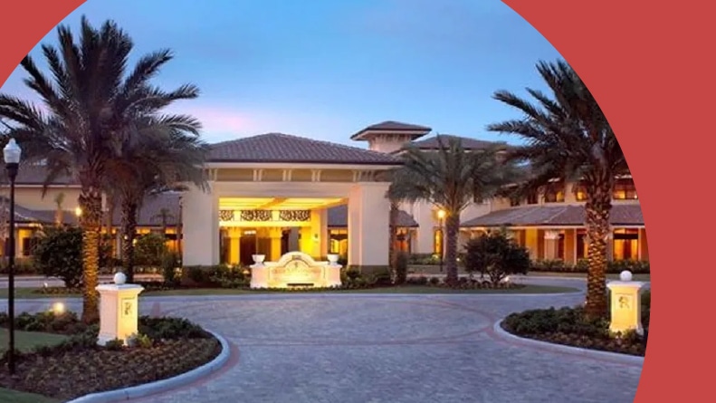 Palm trees beside the entrance to Sun City Center in Sun City Center, Florida.