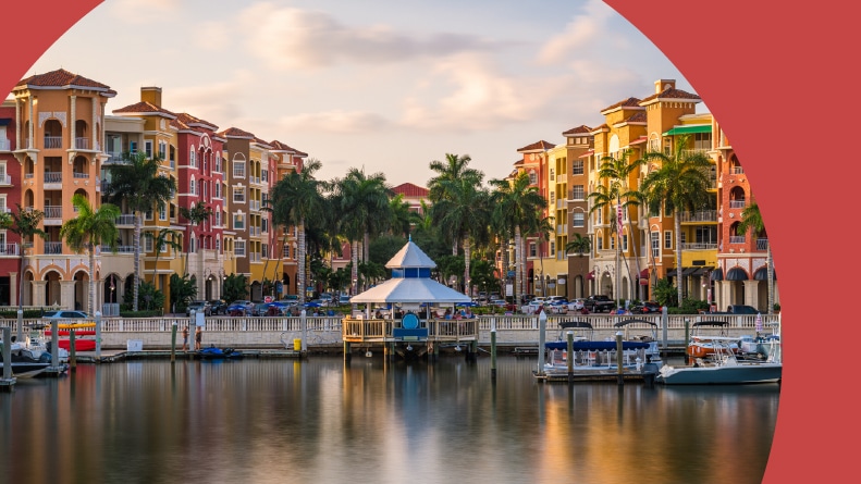 The downtown cityscape on the bay at dusk in Naples, Florida.