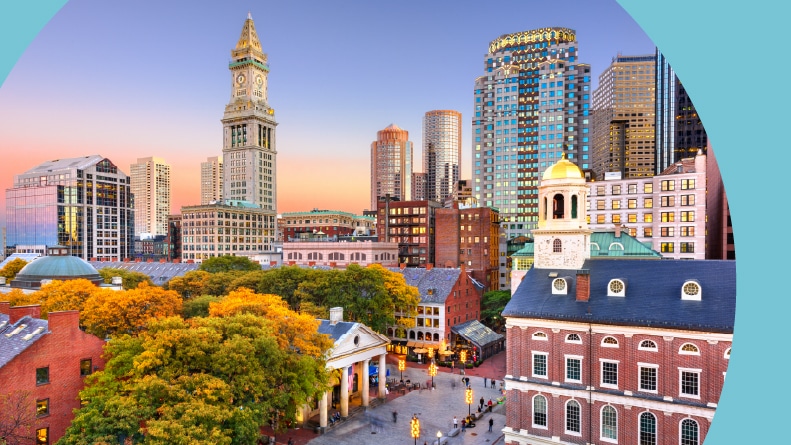 The Boston, Massachusetts skyline with Faneuil Hall and Quincy Market at dusk.