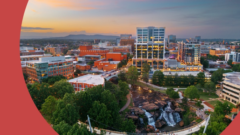Aerial view of Greenville, South Carolina at Falls Park on Reedy Creek at dusk.