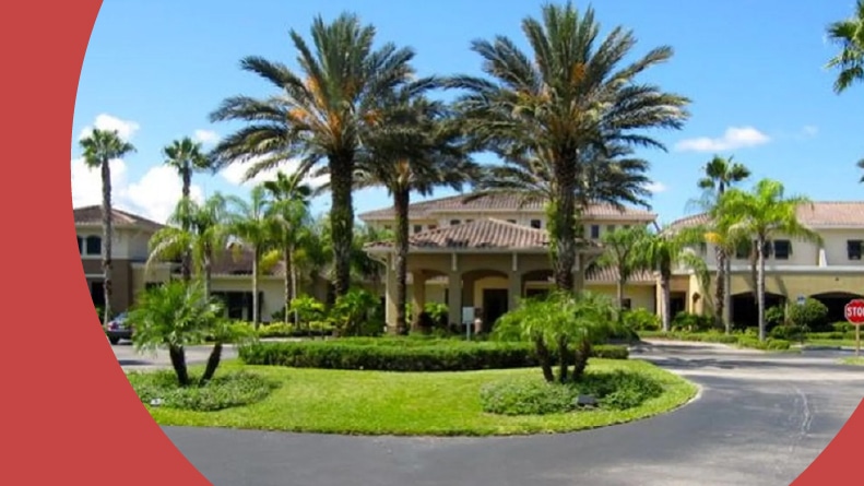 Palm trees surrounding the entrance to Kings Point in Sun City Center, Florida.