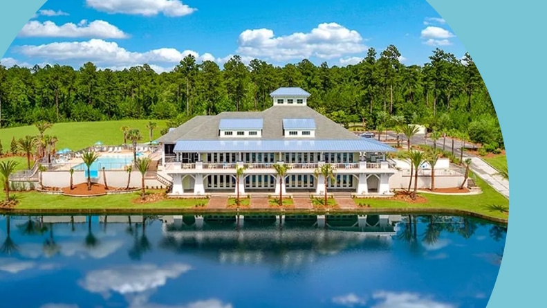 Aerial view of the clubhouse and amenities beside the water at Latitude Margaritaville Hilton Head in Hardeeville, South Carolina.