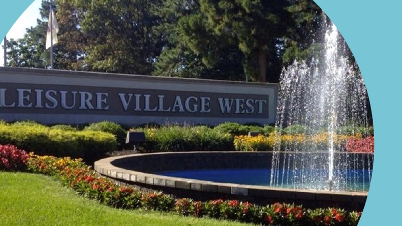Fountain beside the community sign for Leisure Village West in Manchester, New Jersey.
