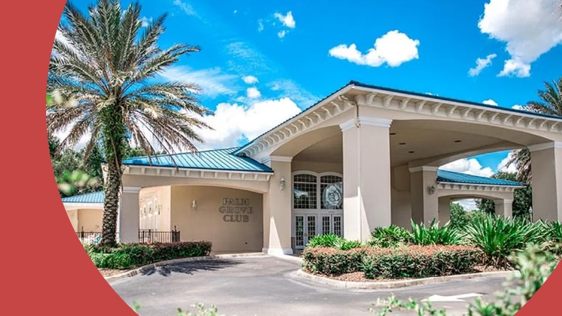 Palm trees beside the Palm Grove Club at Oak Run in Ocala, Florida.