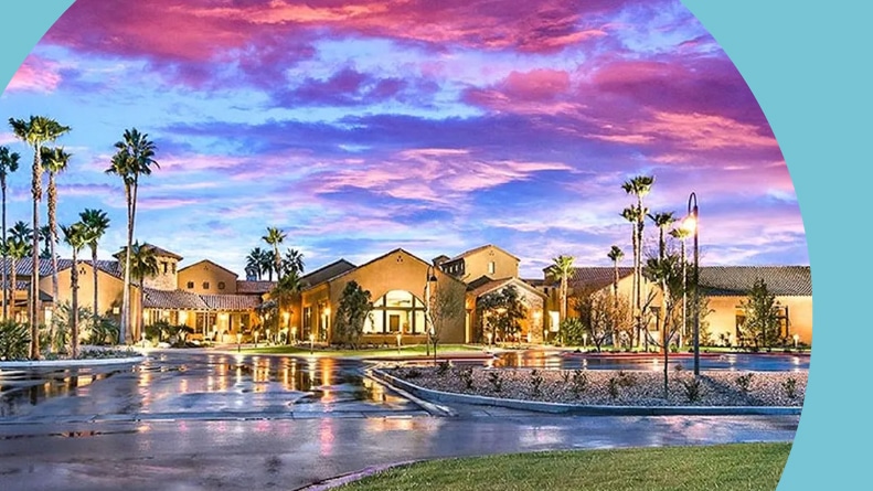 A colorful sunset over the clubhouse at Robson Ranch — Arizona in Eloy, Arizona.