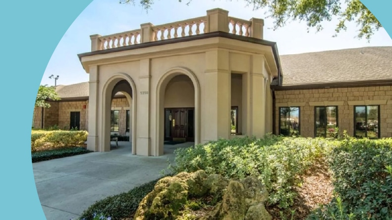 Exterior view of the clubhouse at Royal Highlands in Leesburg, Florida.