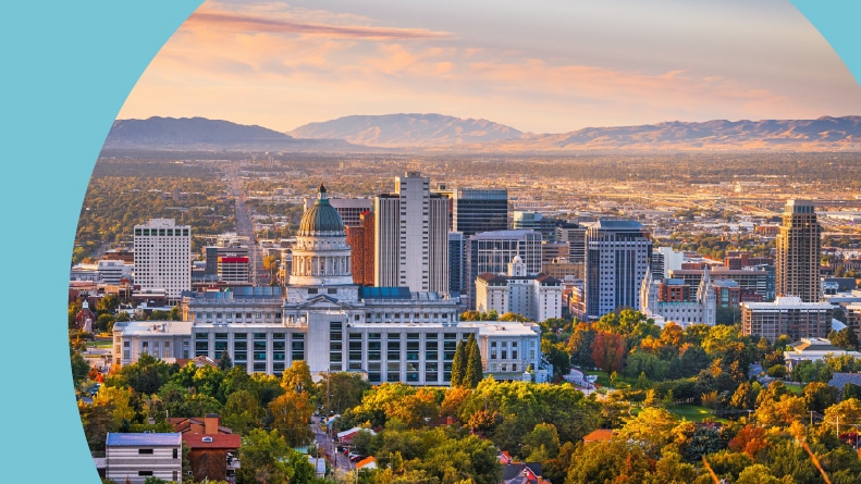 The downtown city skyline of Salt Lake City, Utah at dawn.