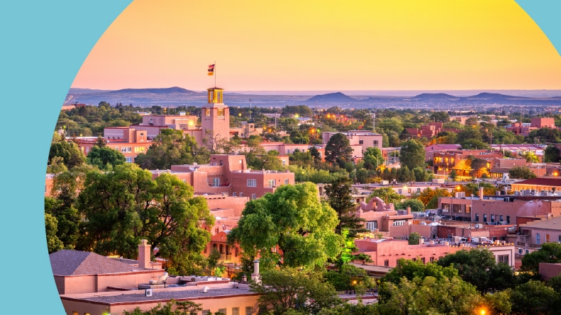 The downtown skyline of Santa Fe, New Mexico at dusk.