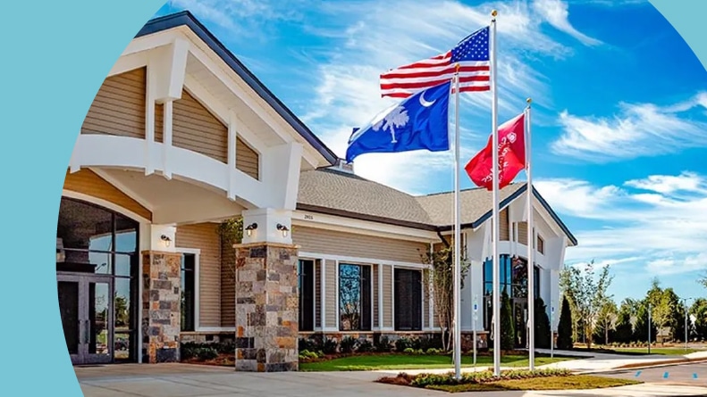 Flags waving outside the clubhouse at Sun City Carolina Lakes in Bluffton, South Carolina.