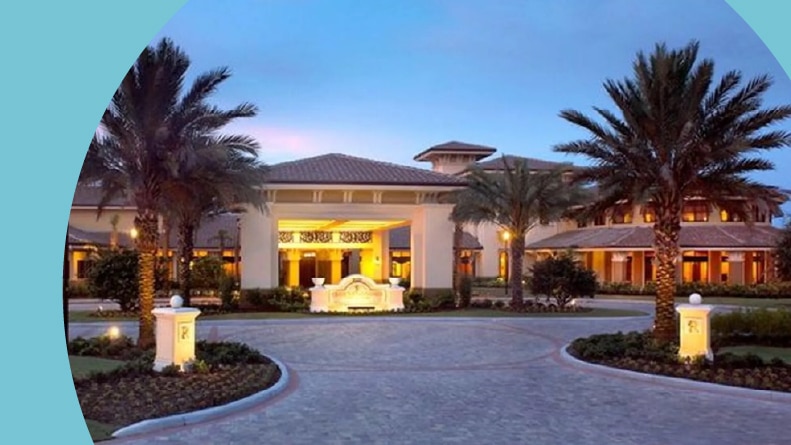 View of the clubhouse at the entrance of Sun City Center in Sun City Center, Florida at twilight.
