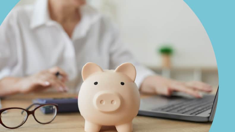Close up of a piggy bank on a table.